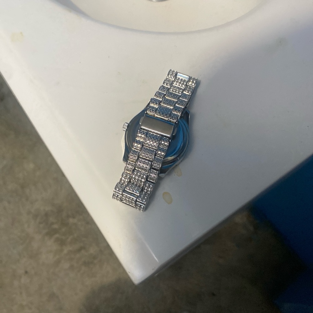 Silver watch encrusted with diamonds